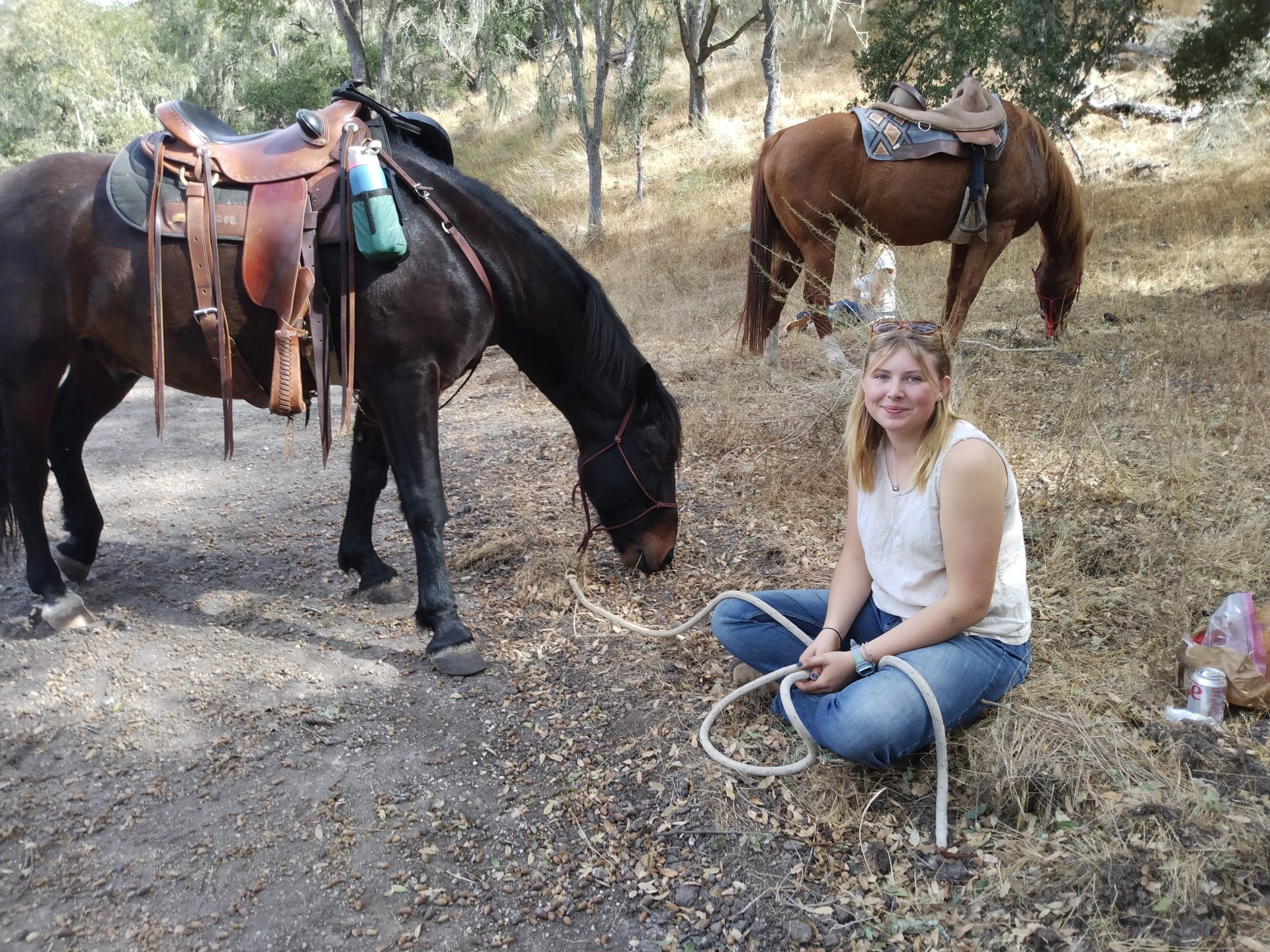 Student with horse on trail ride
